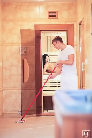 Skinny brunette with long legs decides to fuck the janitor in a sauna